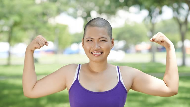 A confident lady smiling, illustrating hope and strength after Colon Cancer Survivors Live Longer.